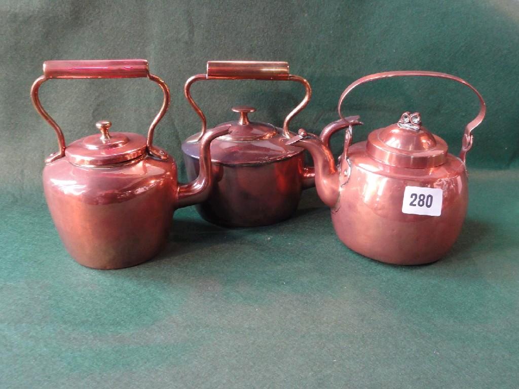 Appraisal: A collection of three miniature brass kettles