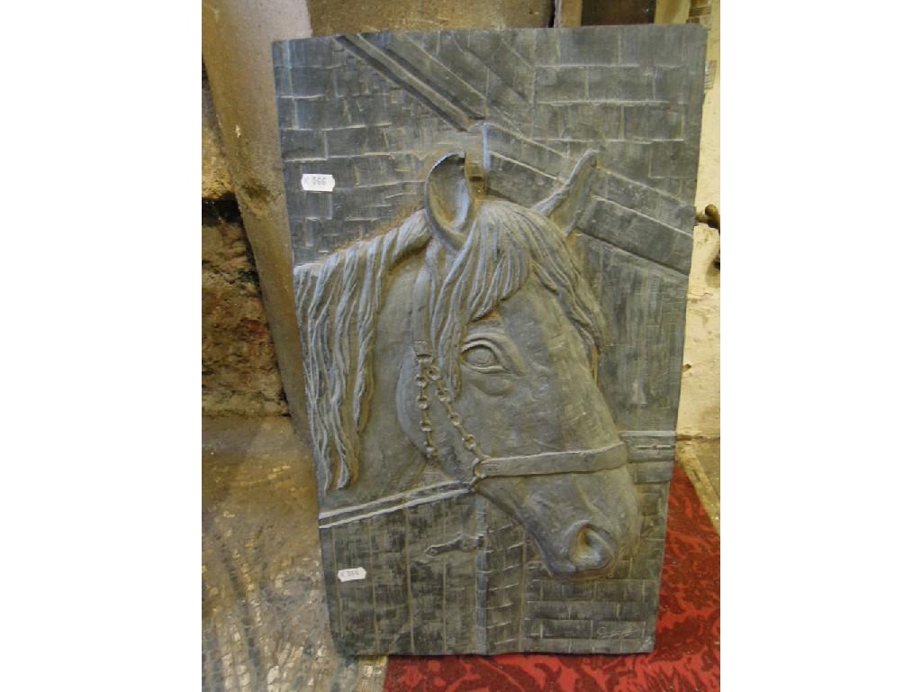 Appraisal: A heavy slate plaque of rectangular form with carved horses