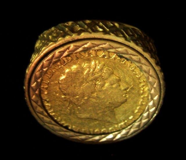 Appraisal: A sovereign ring with a George III sovereign in a