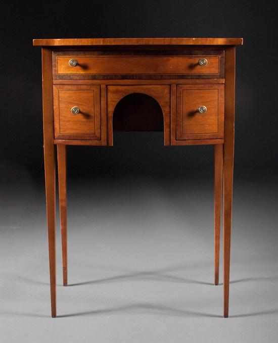 Appraisal: Regency style inlaid and banded mahogany bow-front worktable th century