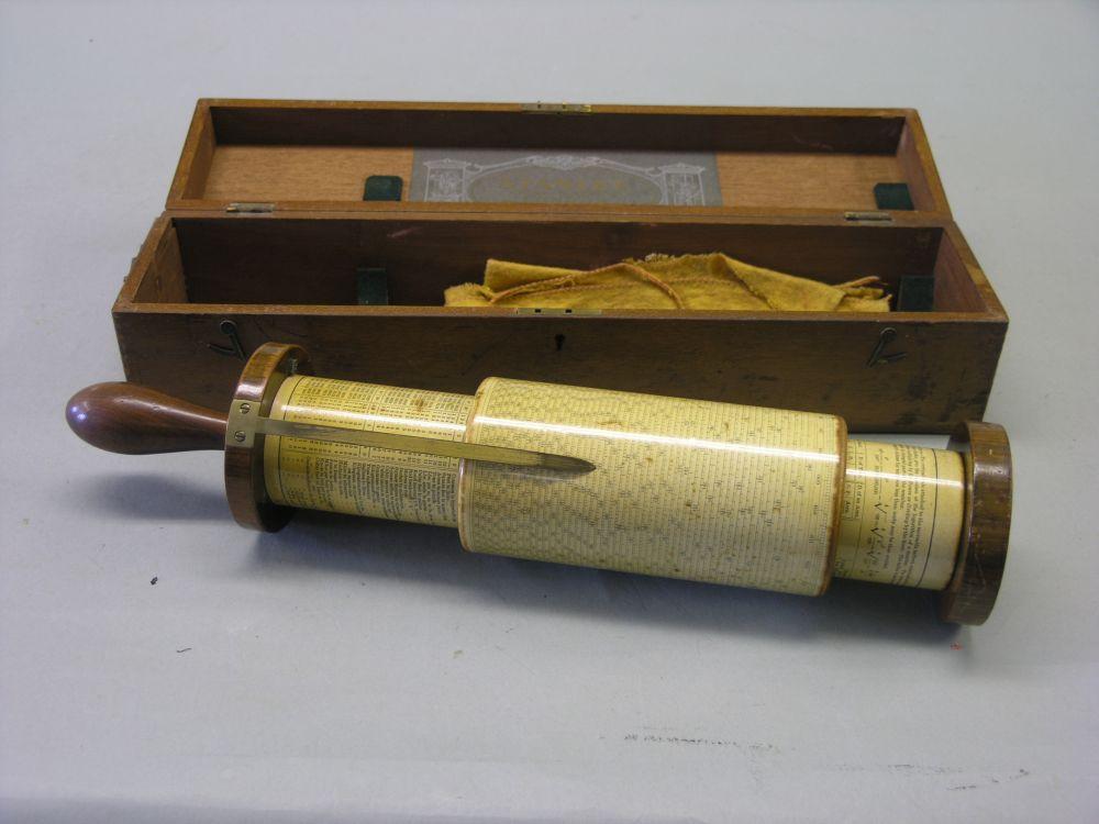 Appraisal: A Stanley slide-rule calculator rotating form with rosewood handle contained