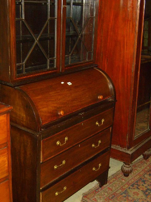 Appraisal: An Edwardian mahogany bureau bookcase the upper section enclosed by