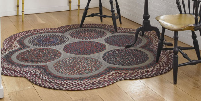 Appraisal: AMERICAN BRAIDED SCALLOPED CIRCULAR RAG RUG CIRCA Illustrated on front