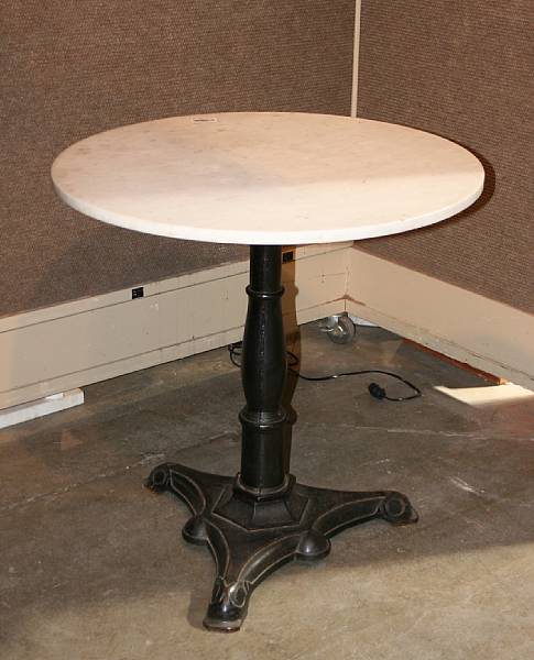 Appraisal: A Neoclassical style cast iron and marble pub table