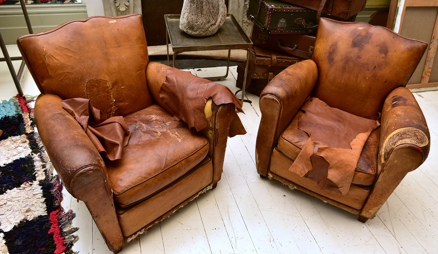 Appraisal: A PAIR OF FRENCH ART DECO ARMCHAIRS IN DISTRESSED BROWN