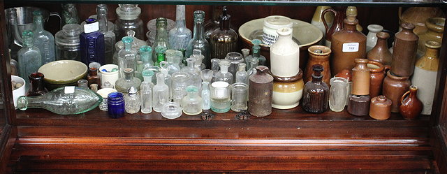 Appraisal: A COLLECTION OF TH CENTURY AND LATER GLASS BOTTLES AND