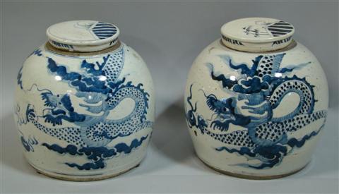 Appraisal: PAIR OF BLUE AND WHITE JARS AND COVERS Of globular