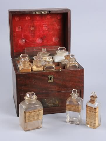 Appraisal: th century wood cased apothecary set consisting of ground stoppered