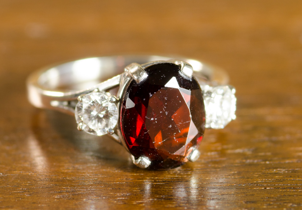 Appraisal: GARNET DIAMOND AND FOURTEEN KARAT GOLD RING The white gold