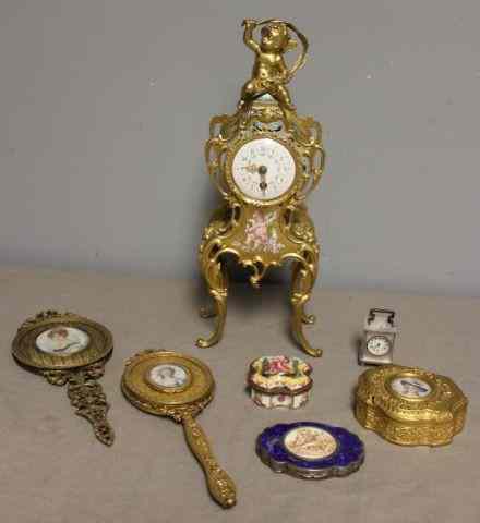 Appraisal: Gilt Bronze and Enamel Decorated French Clock withPutti Surmount With