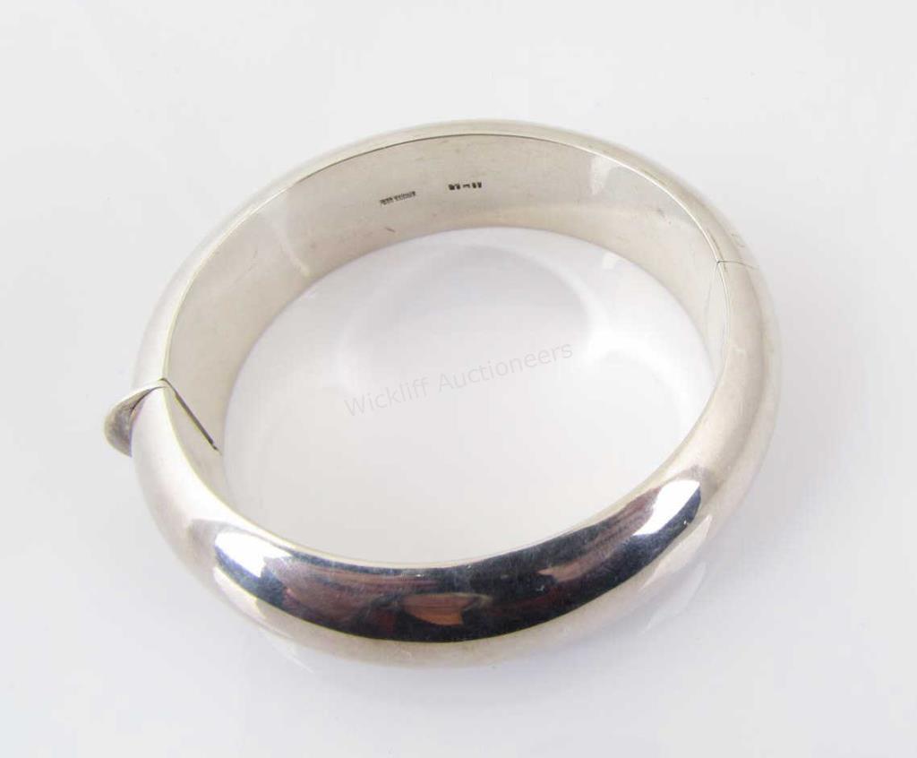 Appraisal: A sterling silver mm wide domed hinged bangle bracelet stamped