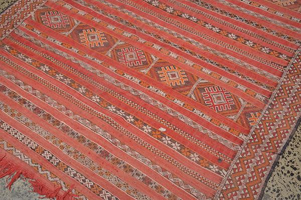 Appraisal: A MOROCCAN TRIBAL RUG with stylized patera bands on a