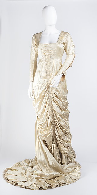 Appraisal: A late Victorian cream satin wedding dress with square neckline