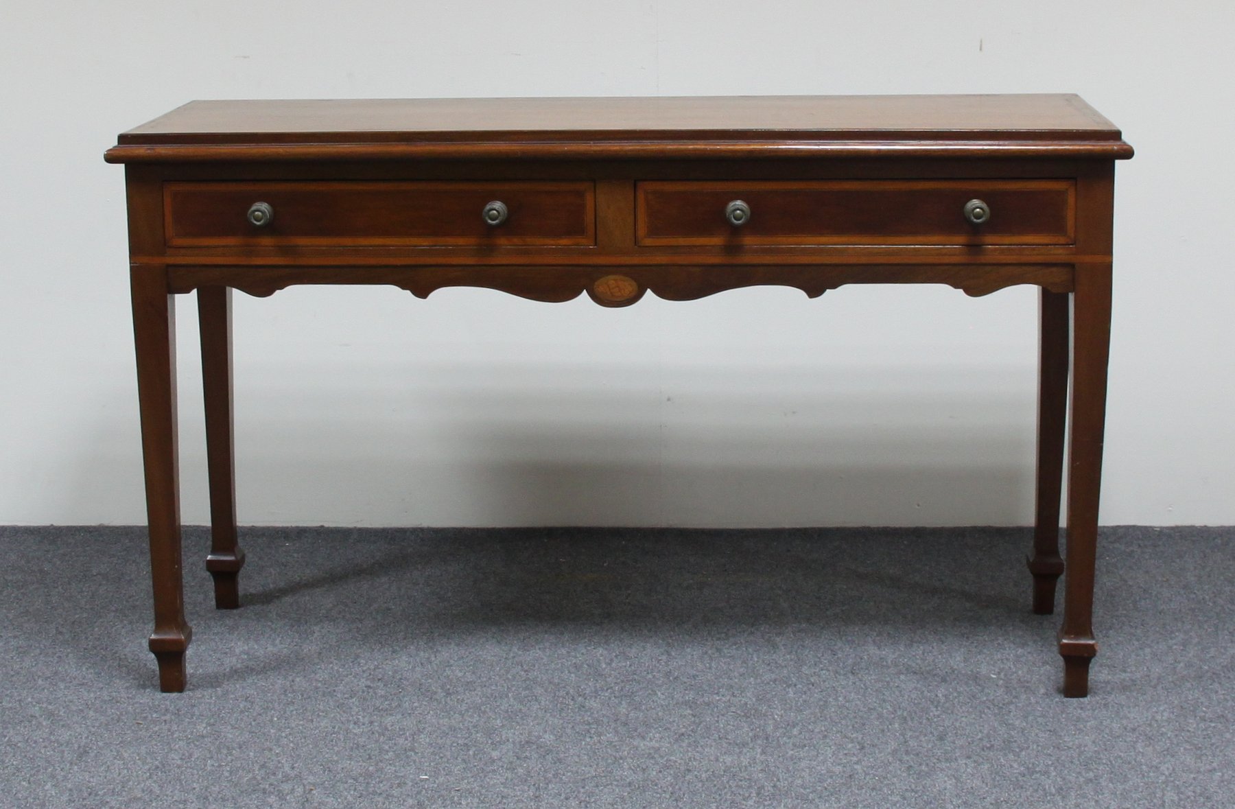 Appraisal: An Edwardian mahogany inlaid side table fitted two drawers on