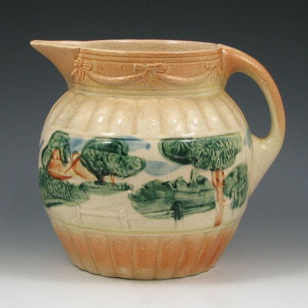 Appraisal: Roseville Utility ware landscape pitcher Unmarked Darkened crazing and staining