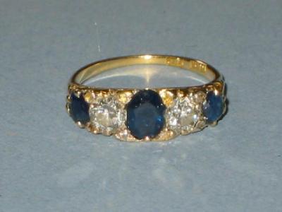 Appraisal: A FIVE STONE SAPPHIRE AND DIAMOND RING the three sapphires