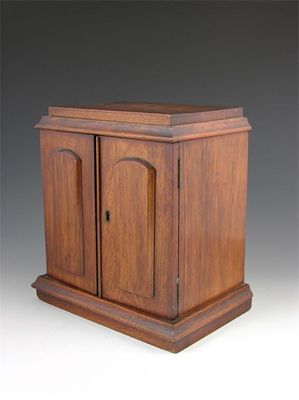 Appraisal: A Victorian mahogany cigar cabinet with three divided drawers having