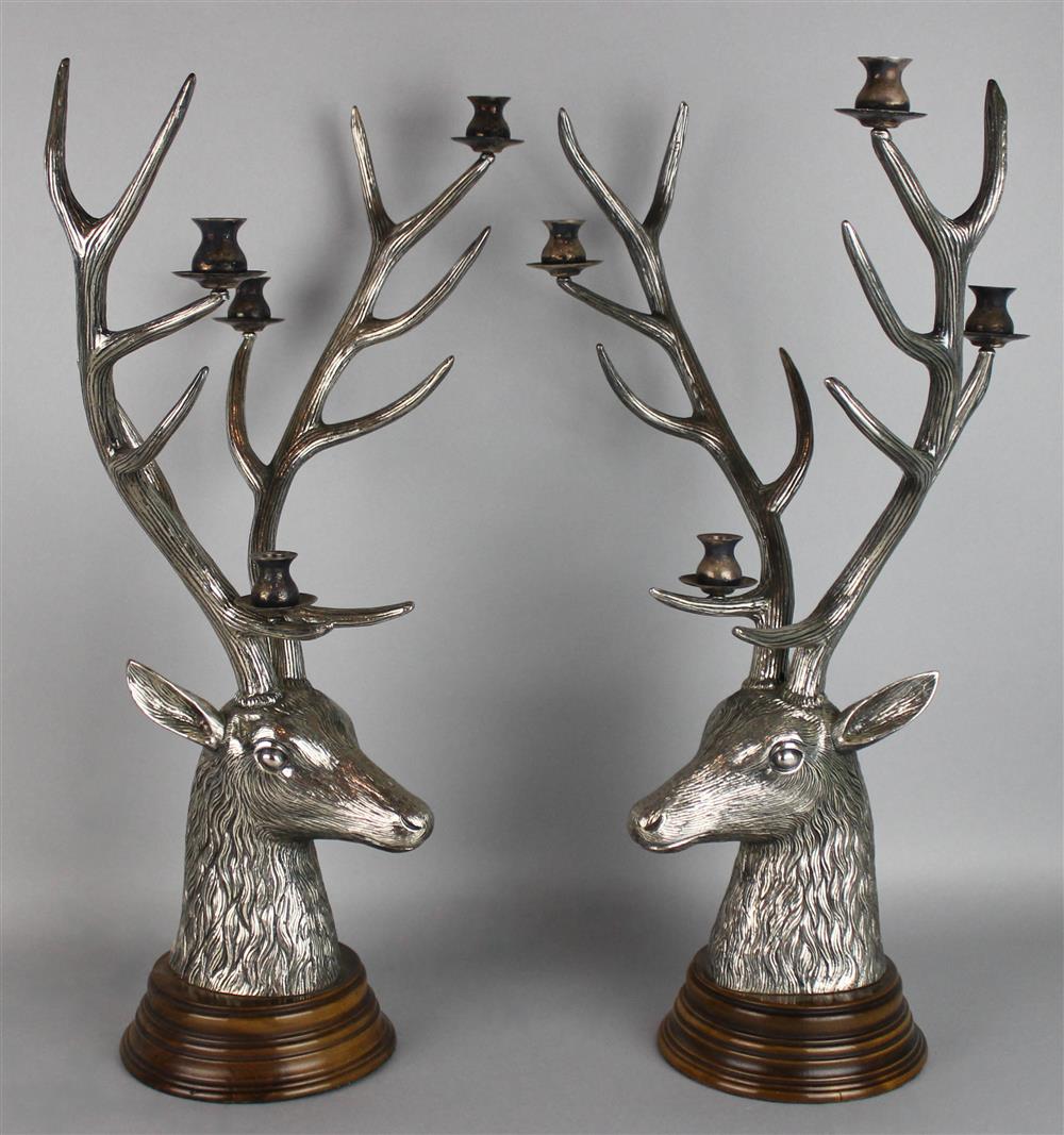 Appraisal: TWO STAG HEAD FORM METAL CANDELABRA the antlers fitted with