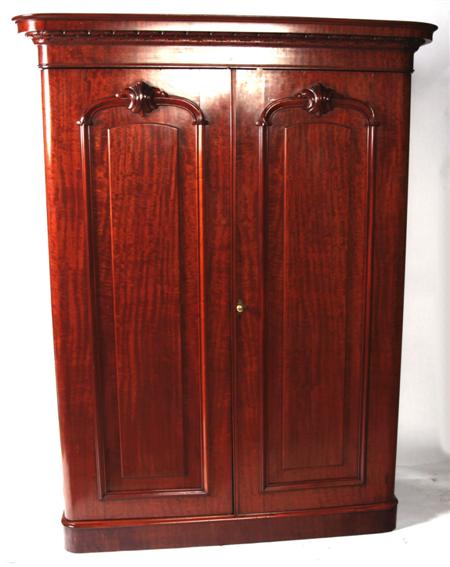 Appraisal: A Victorian mahogany two door wardrobe the moulded cornice over