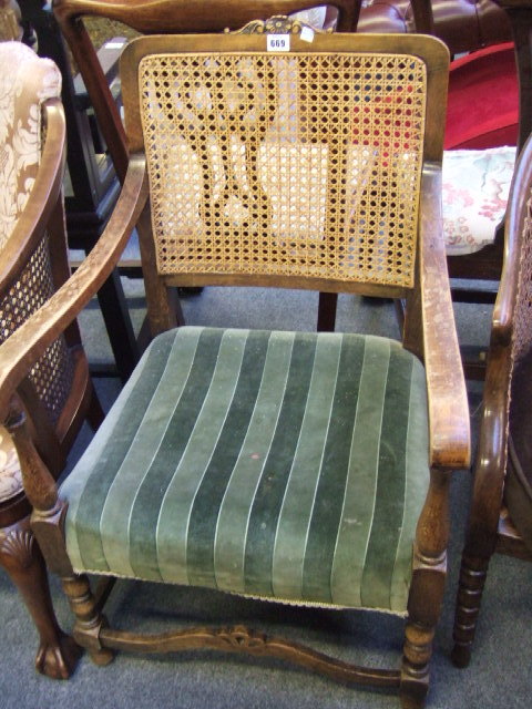 Appraisal: A 's beech open armchair with cane-work back together with