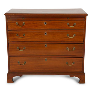 Appraisal: A George III Style Mahogany Bachelor's Chest with Pull-out Slide