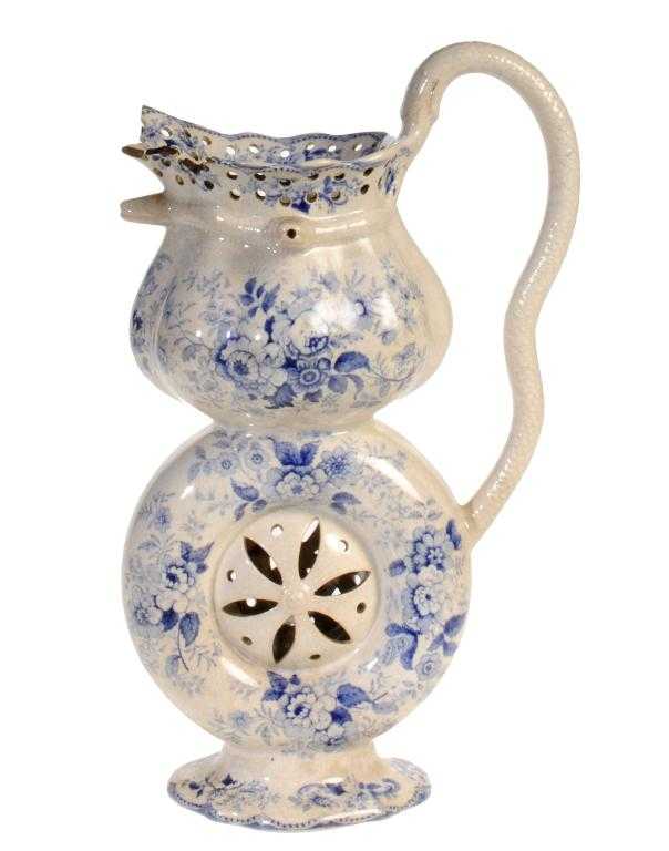 Appraisal: A BLUE PRINTED EARTHENWARE PUZZLE JUG with snake handle and