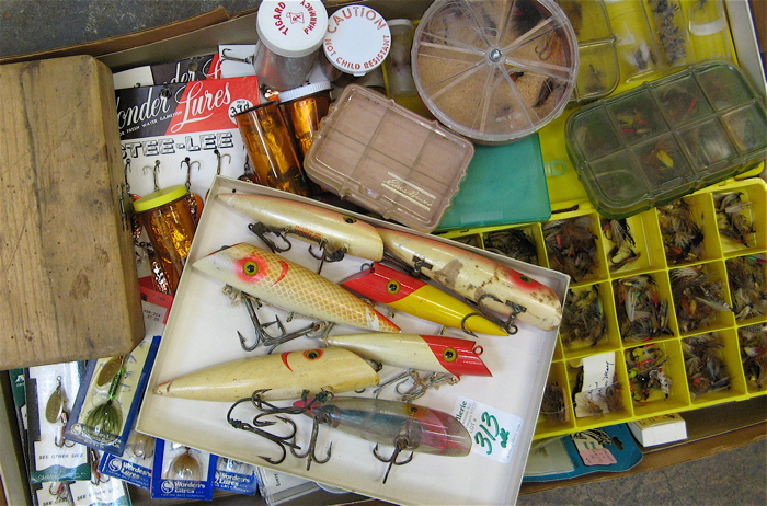 Appraisal: LARGE COLLECTION OF FISHING FLIES REELS AND WOODEN FISHING PLUGS