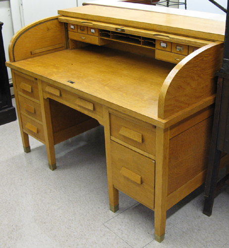 Appraisal: AN OAK ROLL TOP DESK American early th century The