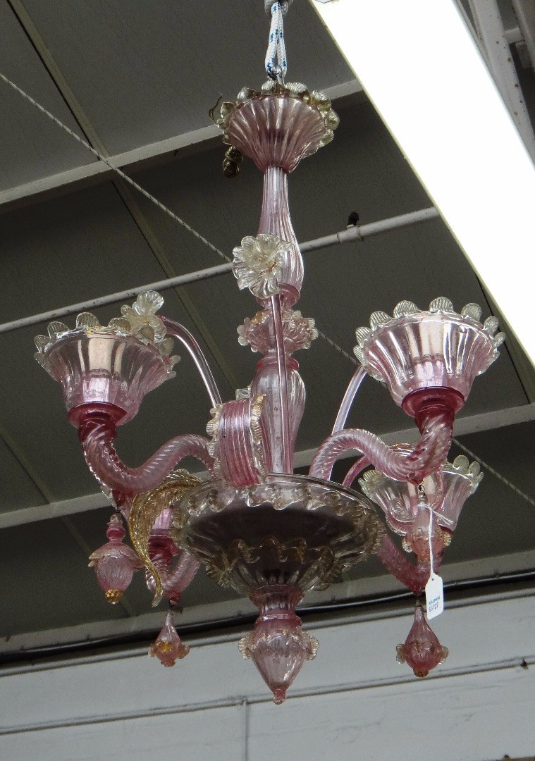 Appraisal: A Victorian cranberry glass chandelier the baluster stem issuing four