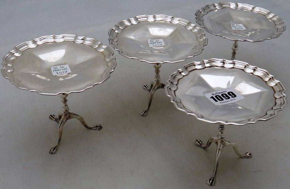 Appraisal: A set of four silver bonbon stands each modelled as