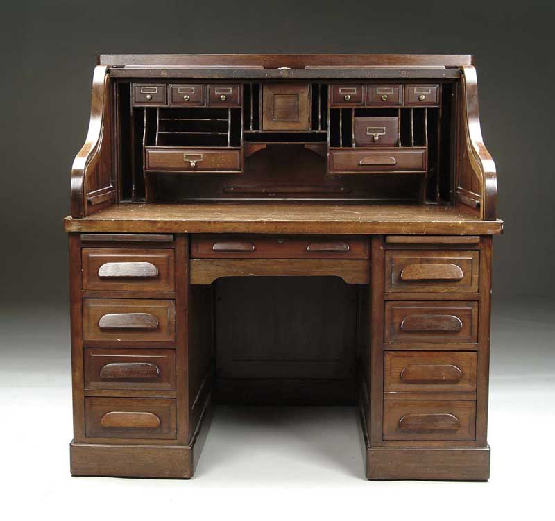 Appraisal: MAHOGANY S-ROLL TOP DESK Double bank with four drawers on