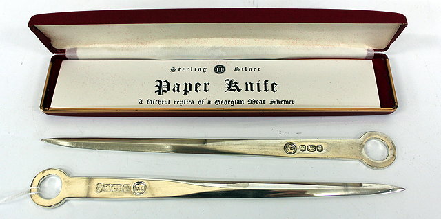 Appraisal: A SOLID SILVER PAPER KNIFE in the form of a