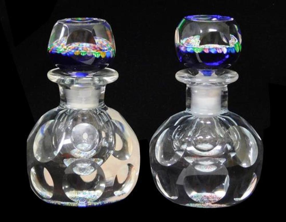 Appraisal: GLASS Perthshire Paperweights two matching glass bottles with multicolored millefiori