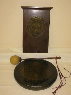 Appraisal: A VICTORIAN BRASS GONG suspended from a mahogany oblong panel