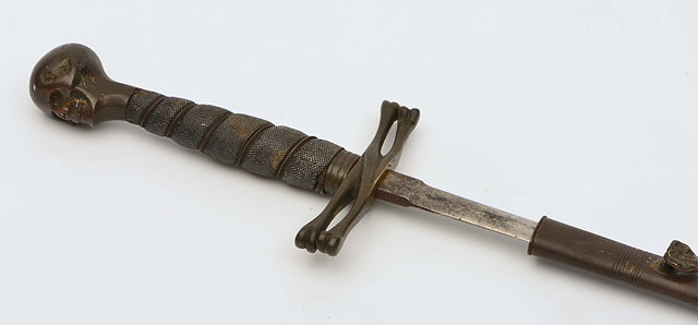 Appraisal: A MASONIC CEREMONIAL SWORD with bronze skull pommel shagreen grip