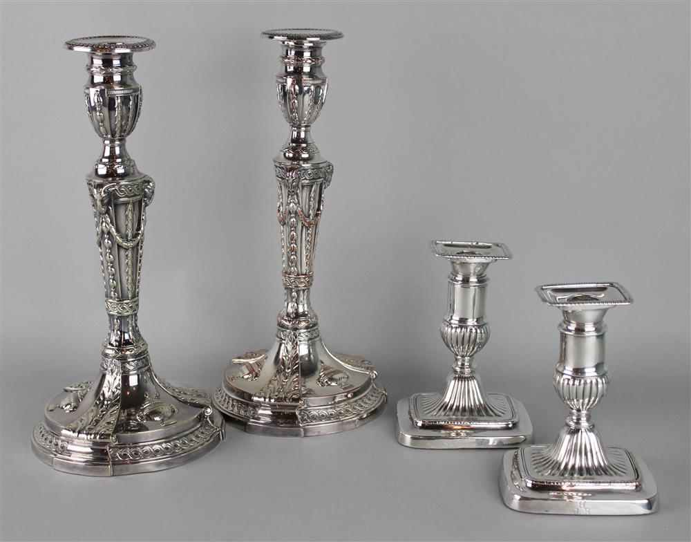 Appraisal: PAIR OF BARKER ELLIS SILVERPLATED CANDLESTICKS pineapple marks to both