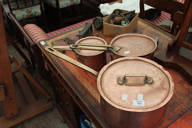 Appraisal: A MATCHING SET OF THREE GRADUATED COPPER SAUCEPANS the largest