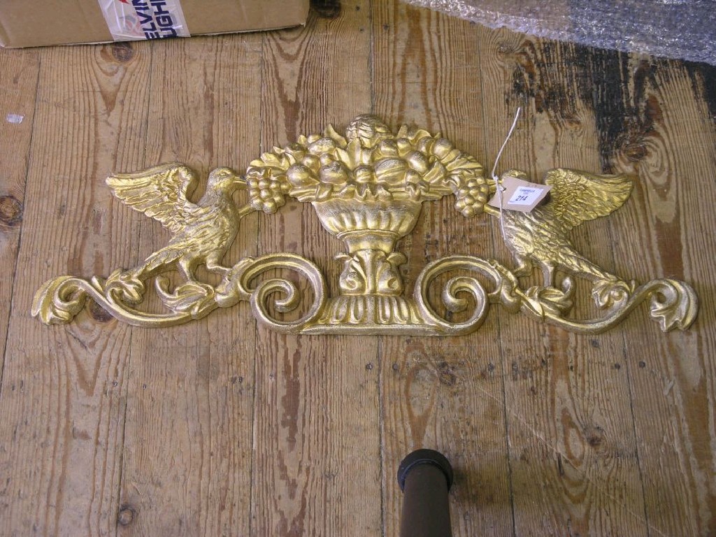 Appraisal: A pair of gilded cast iron door pediments cast with