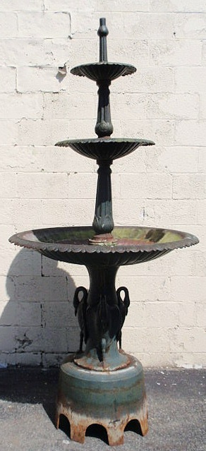 Appraisal: Cast iron Victorian style three-tier fountain with a swan motif