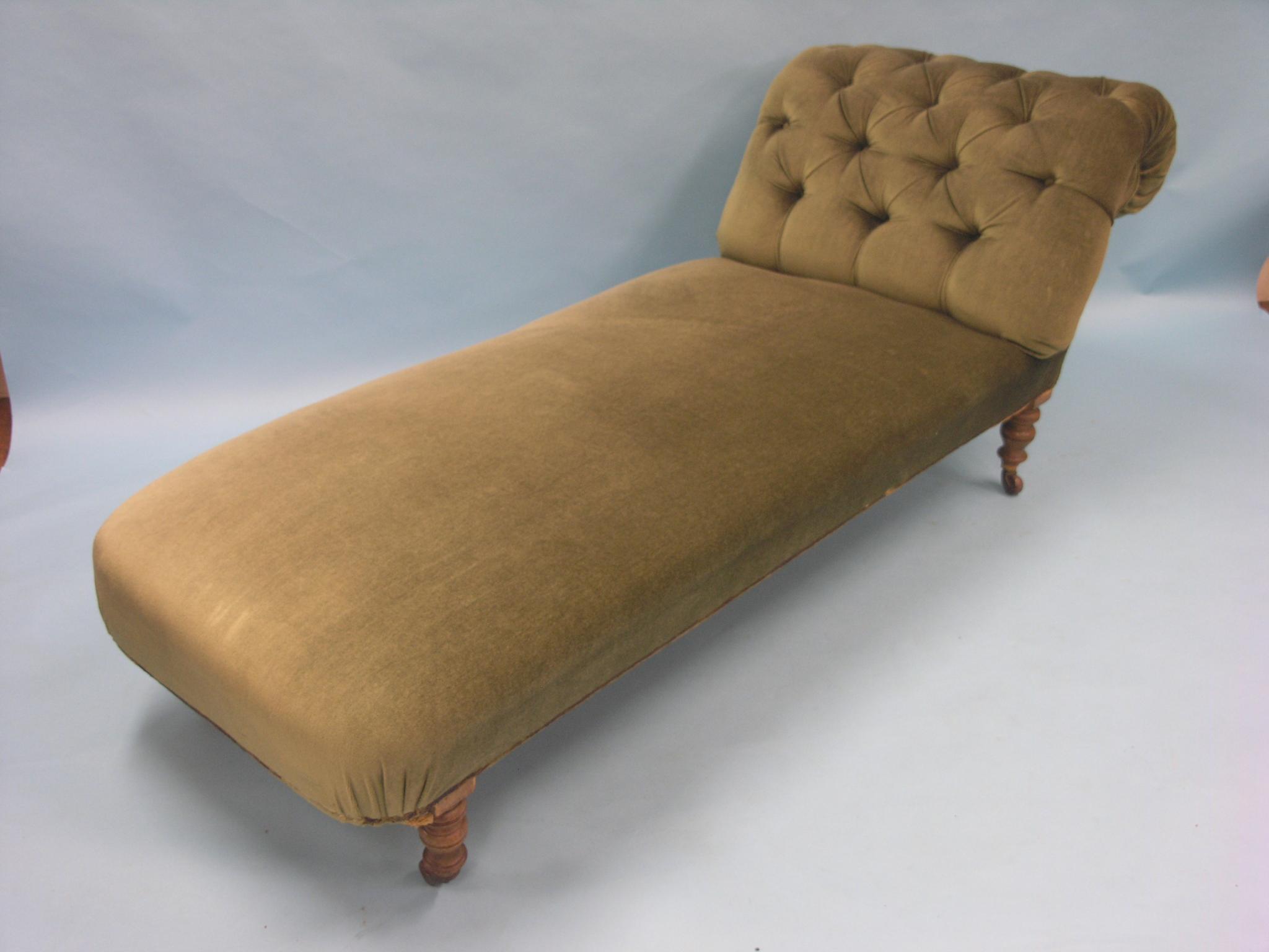 Appraisal: A Victorian oak-framed chaise longue upholstered in a buttoned green