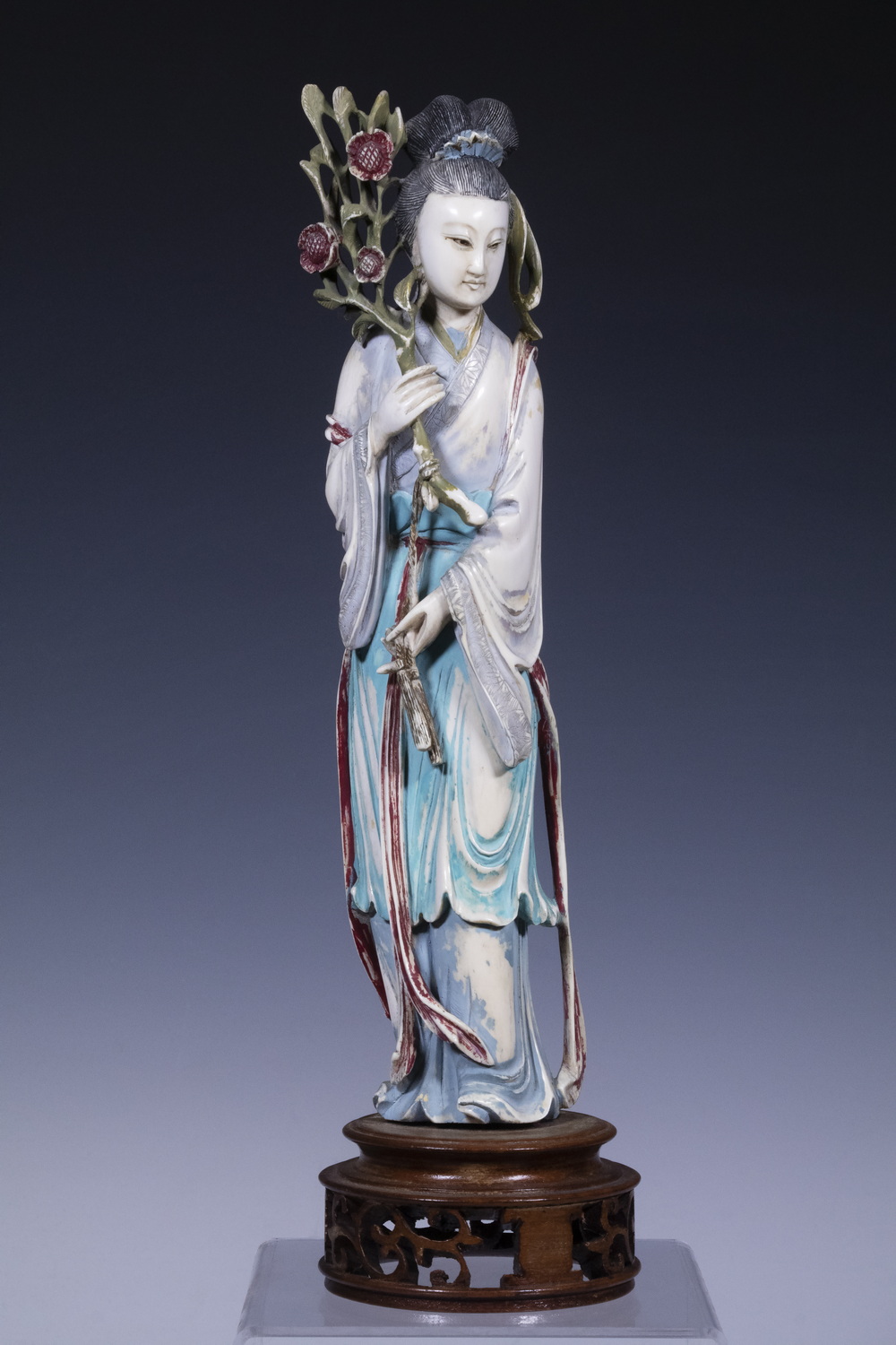 Appraisal: JAPANESE PAINTED IVORY FIGURE Bijin-ga holding a blooming cherry branch