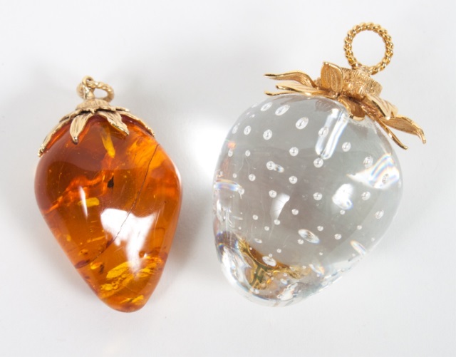 Appraisal: Two gold-mounted strawberry form pendants one in amber the other