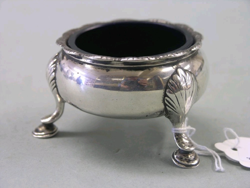 Appraisal: A George III silver salt circular shape on three shell