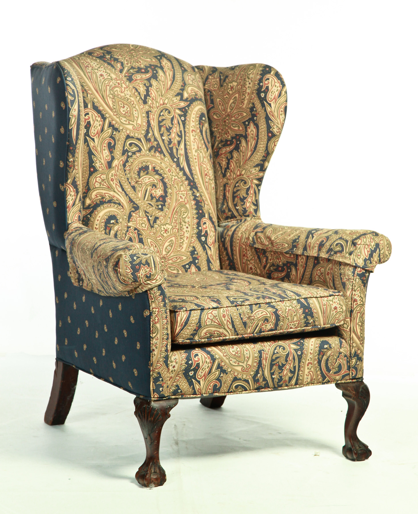 Appraisal: CHIPPENDALE-STYLE EASY CHAIR Eighteenth-nineteenth century mahogany Shell-carved knees and paisley