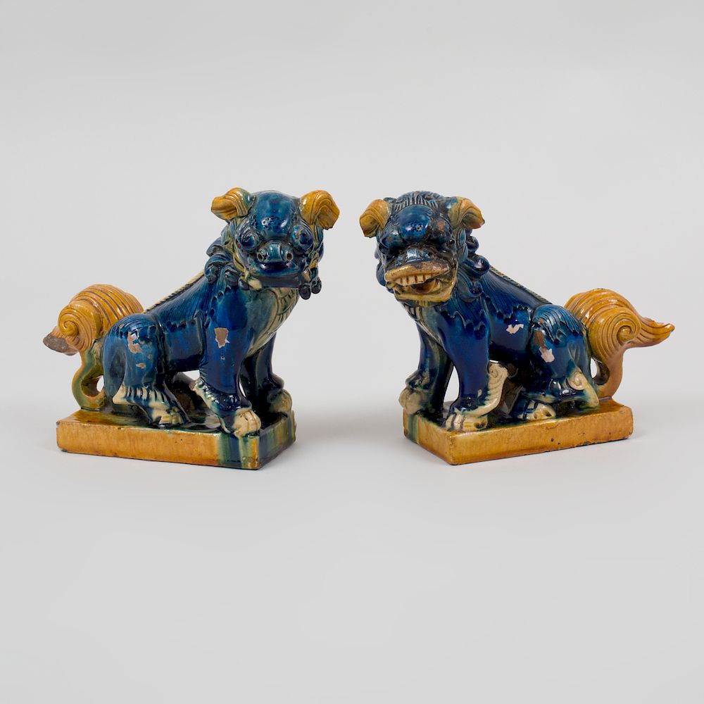 Appraisal: Pair of Chinese Sancai Glazed Pottery Figures of Buddhistic Lions