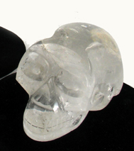 Appraisal: A NATURAL ROCK CRYSTAL SCULPTED FIGURE OF A HUMAN SKULL