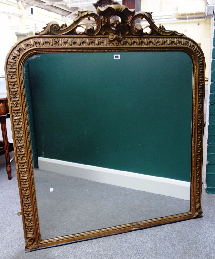 Appraisal: An early Victorian gilt framed overmantel mirror with pierced cartouche