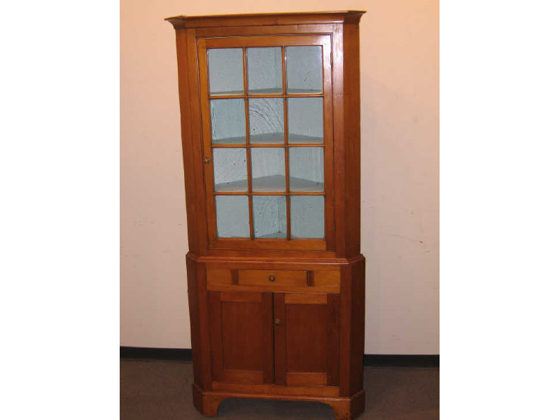 Appraisal: AMERICAN TH CENTURY CHERRY CORNER CUPBOARD The two member unit