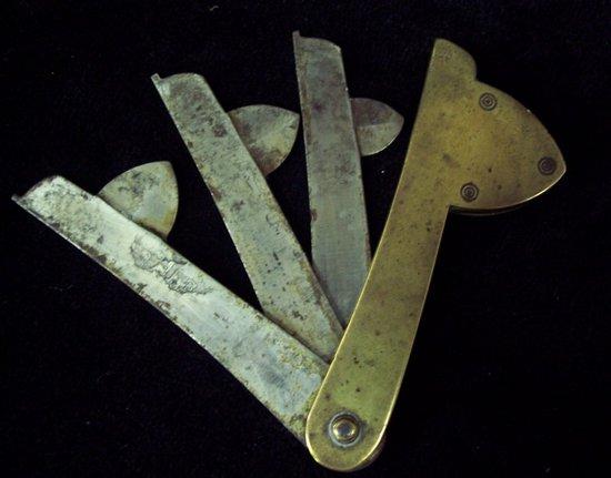 Appraisal: A brass cased fleam fitted three graduated blades