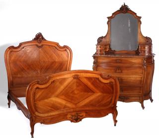 Appraisal: A CIRCA FRENCH CARVED WALNUT TWO-PIECE BEDROOM SET The bed